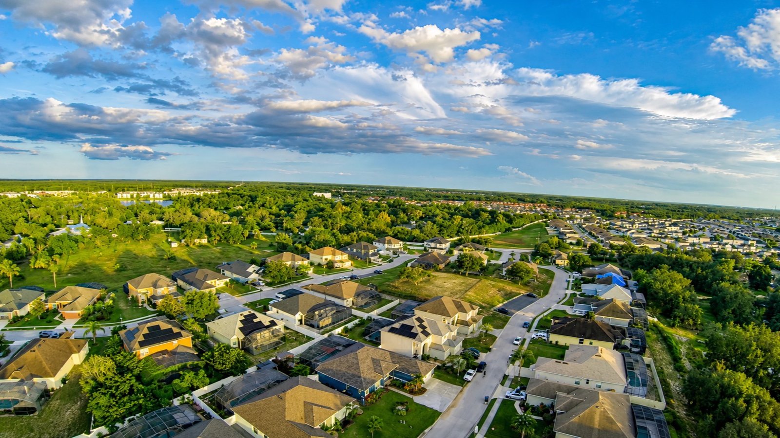 FPV drone view over a residential neighborhood at golden hour, Davenport, Florida